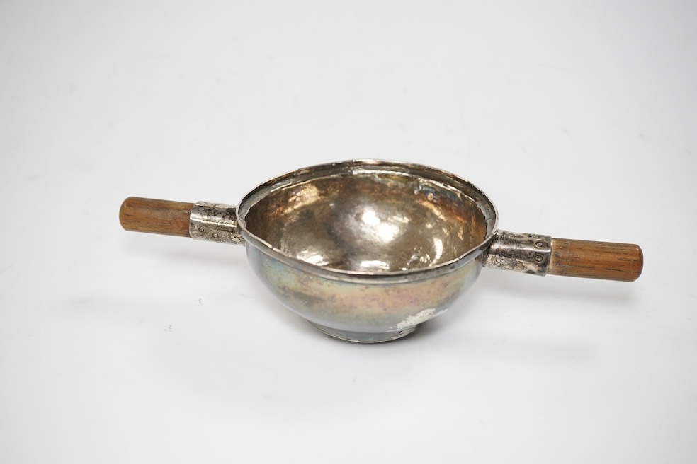 A Victorian silver sauce boat, London, 1876, length 14.2cm and metal quaich (adapted). Condition - poor to fair